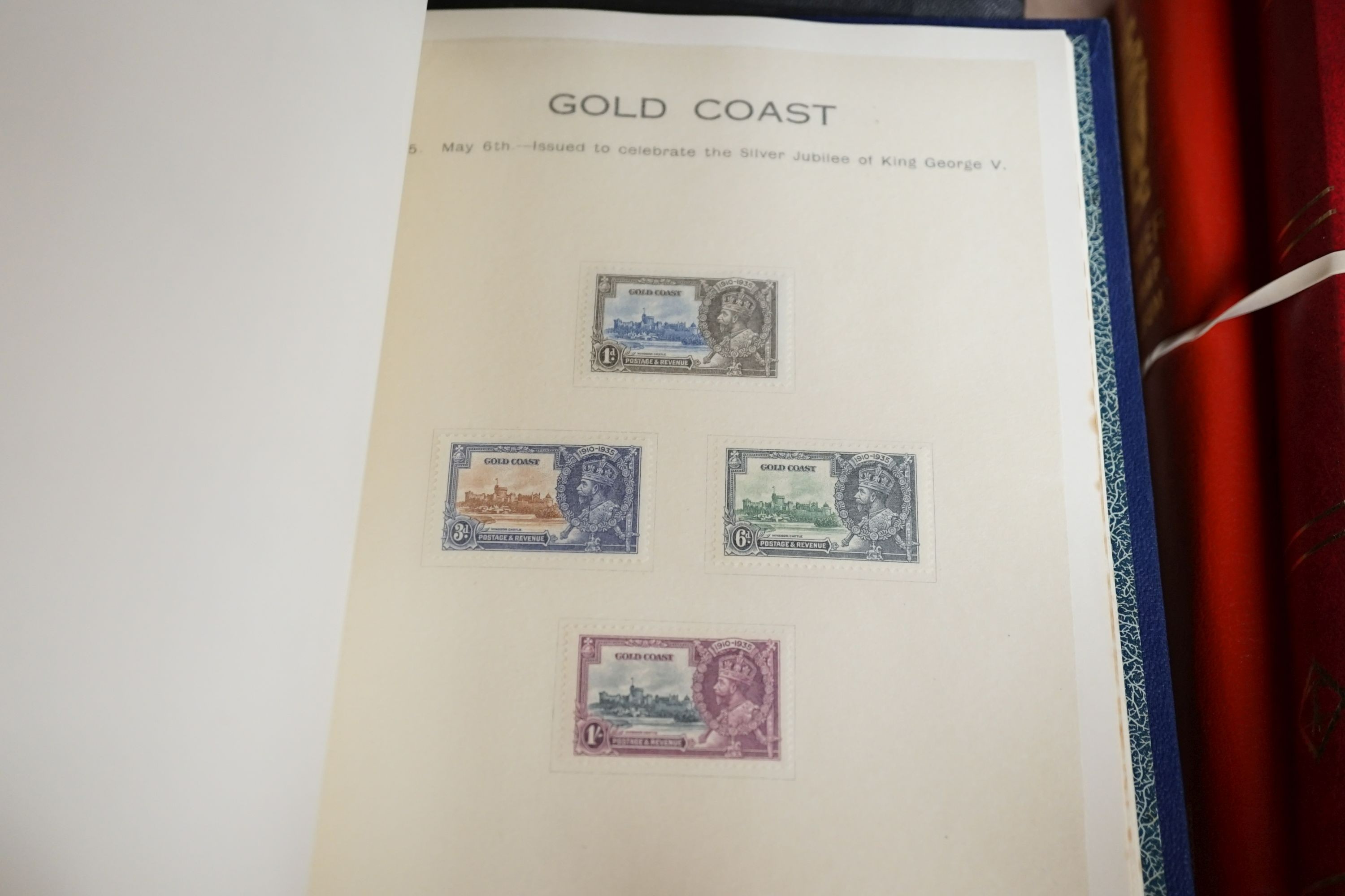 Three stamp albums with 1935 Silver Jubilee mint set of 250 including Egypt, 1937 Coronation two mint sets plus some used